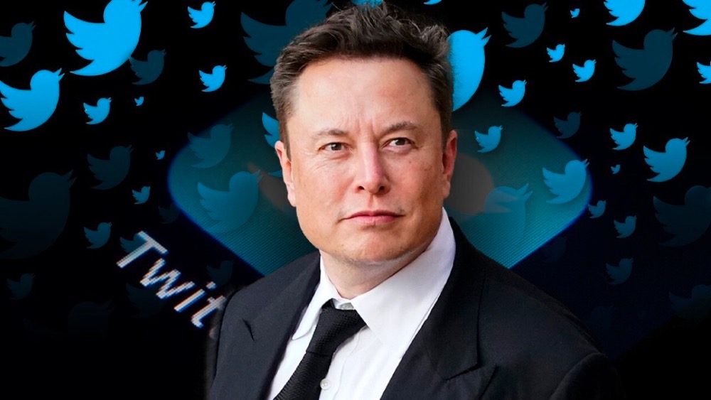 Elon Musk with Twitter backdrop