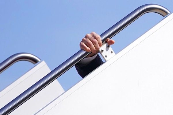 Joe Biden falling on stairs to get on plane